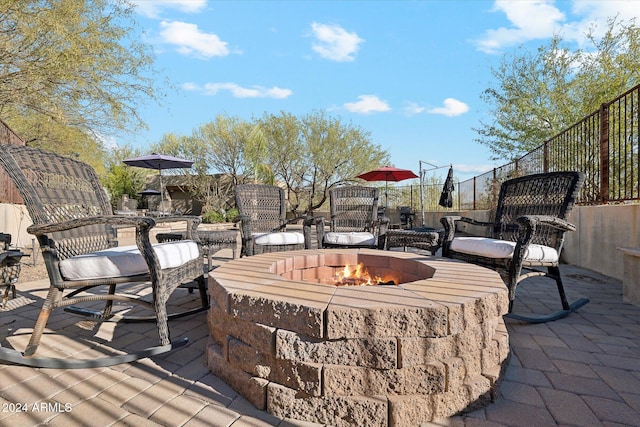 deck with a fire pit and a patio area