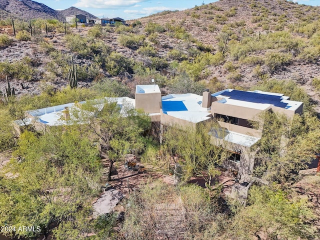 drone / aerial view featuring a mountain view