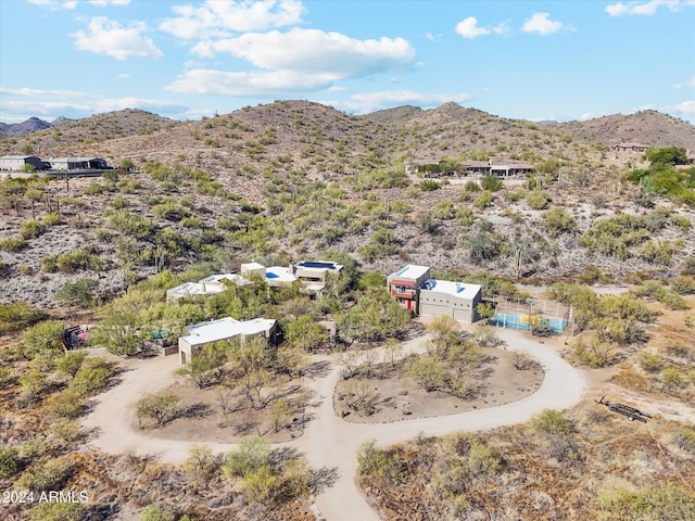 birds eye view of property featuring a mountain view