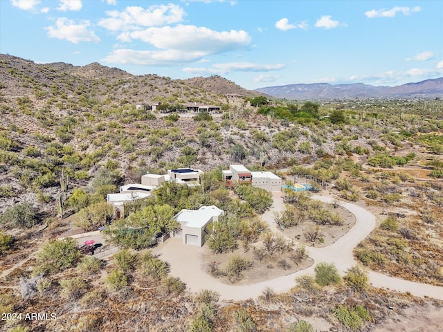 birds eye view of property featuring a mountain view