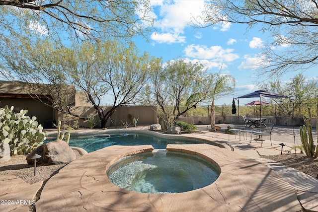 36600 N 50th St, Cave Creek, AZ 85331 - view of swimming pool featuring a patio area, a fenced backyard, and a pool with connected hot tub