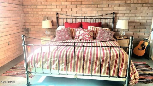 bedroom featuring concrete flooring