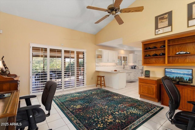 tiled home office featuring built in desk, high vaulted ceiling, and ceiling fan