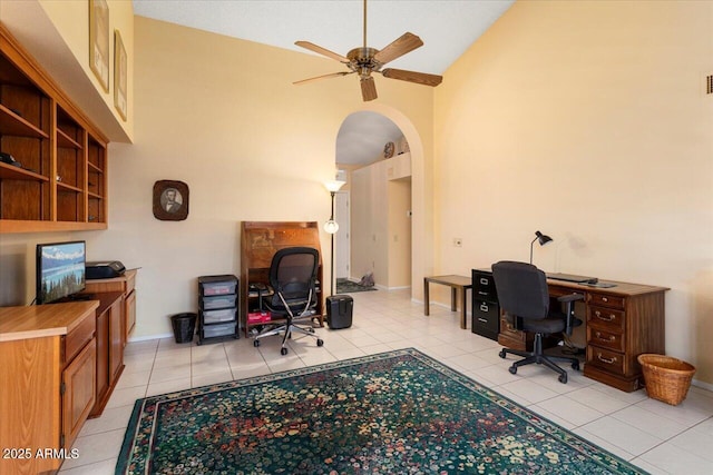 office with light tile patterned floors, high vaulted ceiling, and ceiling fan