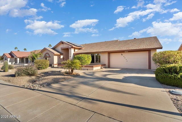 single story home featuring a garage