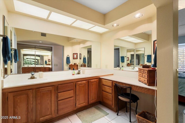 bathroom with vanity and tile patterned floors