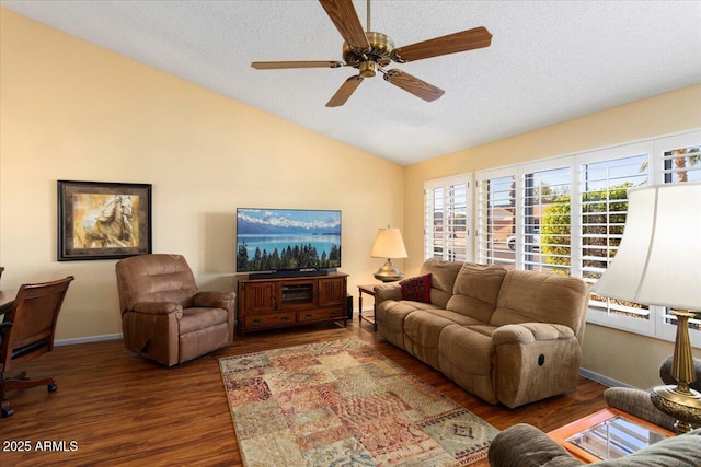 living room with ceiling fan, lofted ceiling, a textured ceiling, and dark hardwood / wood-style flooring