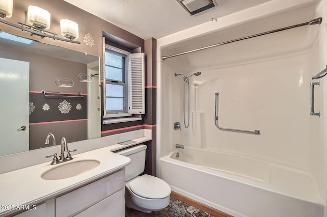 full bathroom featuring vanity, shower / bath combination, and toilet