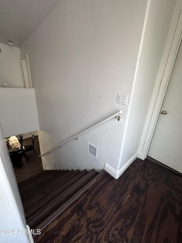 stairs with wood-type flooring