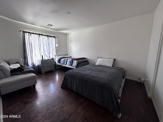 bedroom featuring dark hardwood / wood-style floors