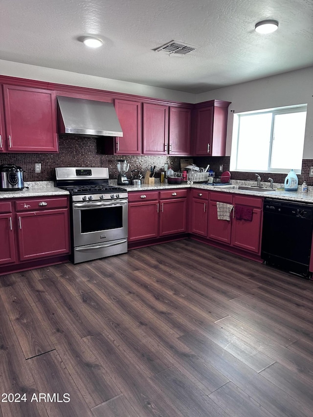 kitchen featuring a textured ceiling, wall chimney range hood, black dishwasher, stainless steel gas stove, and dark hardwood / wood-style floors