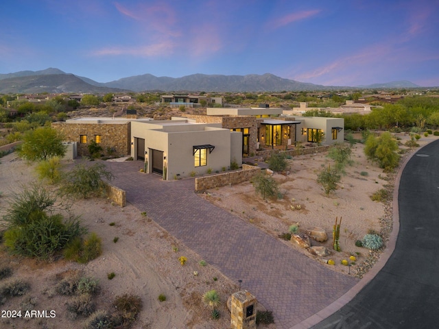 9940 E Aleka Way, Scottsdale, AZ 85262 - view of front of house with stucco siding, a garage, and a mountain view