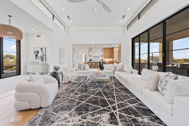 9940 E Aleka Way, Scottsdale, AZ 85262 - living room with a high ceiling, ceiling fan, wood finished floors, and recessed lighting