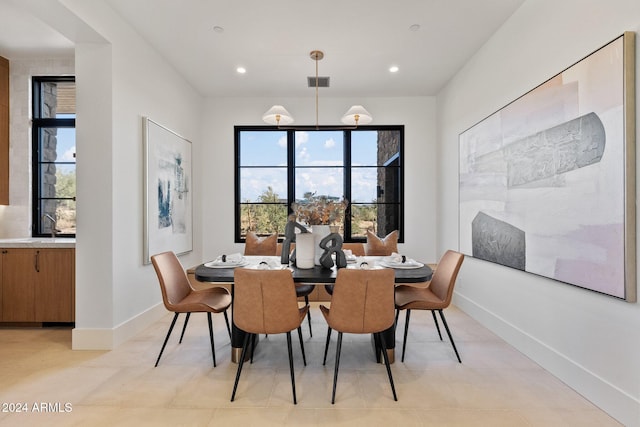 dining room featuring light tile patterned flooring