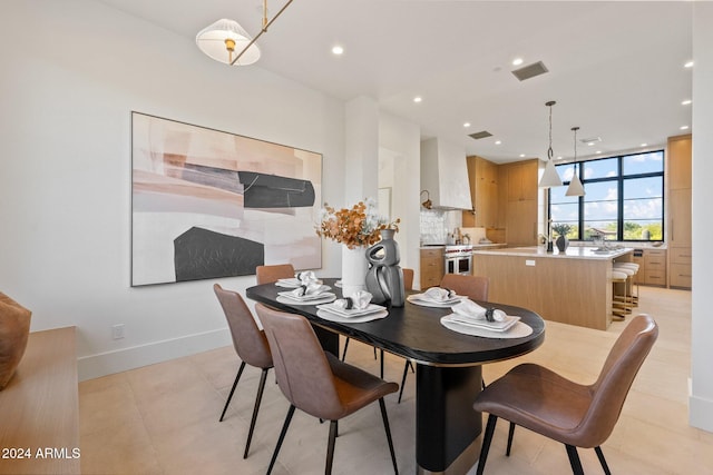 dining space with light tile patterned flooring