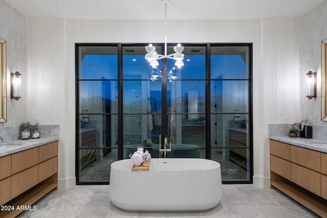 bathroom with plus walk in shower, vanity, and a notable chandelier