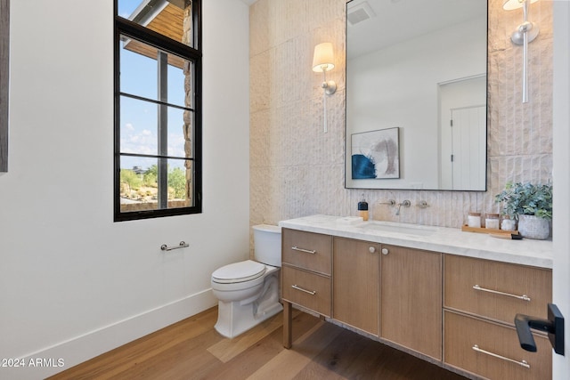 9940 E Aleka Way, Scottsdale, AZ 85262 - bathroom with vanity, plenty of natural light, wood finished floors, and toilet