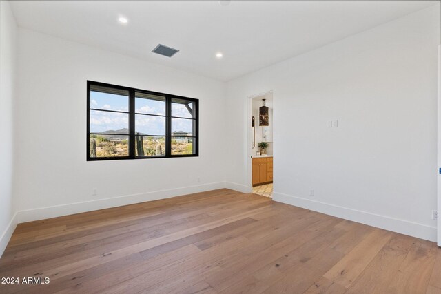 9940 E Aleka Way, Scottsdale, AZ 85262 - unfurnished room with light wood-style floors, baseboards, and recessed lighting