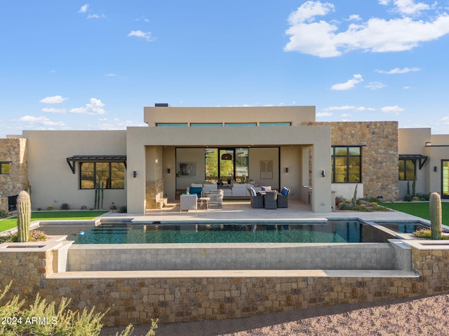 9940 E Aleka Way, Scottsdale, AZ 85262 - back of property with an outdoor living space, stucco siding, an outdoor pool, and a patio area