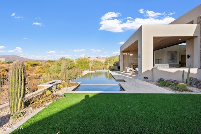 9940 E Aleka Way, Scottsdale, AZ 85262 - view of yard with an infinity pool, a patio area, and a mountain view