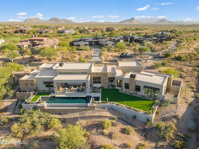 birds eye view of property featuring a mountain view