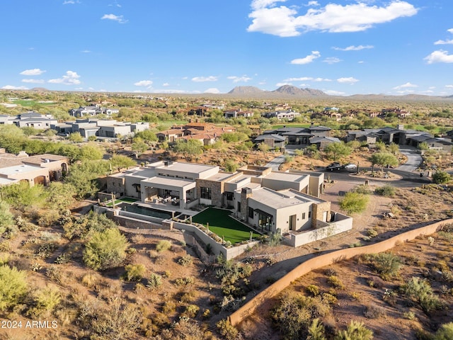 birds eye view of property featuring a mountain view