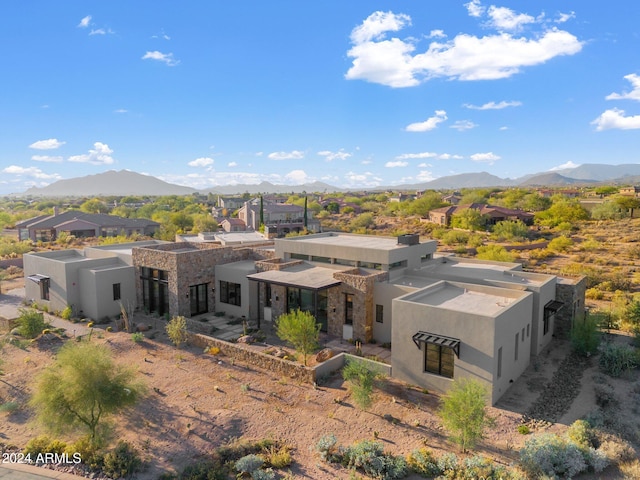 back of property with a mountain view