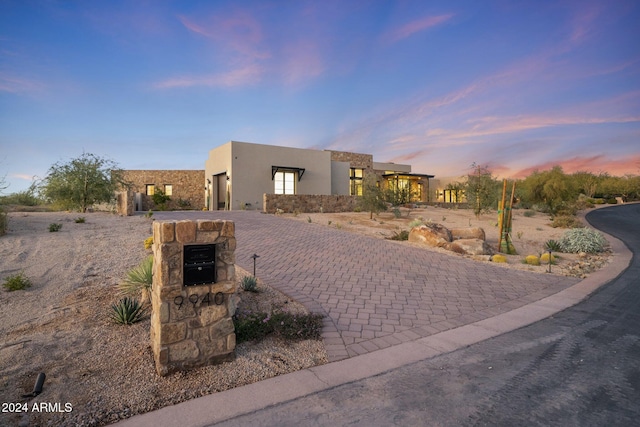 9940 E Aleka Way, Scottsdale, AZ 85262 - view of front of home with a garage, stucco siding, and decorative driveway
