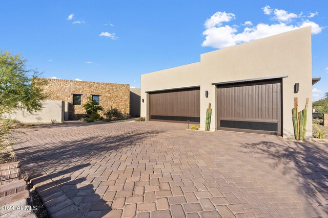 9940 E Aleka Way, Scottsdale, AZ 85262 - view of front of home featuring stucco siding and decorative driveway