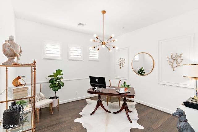 office area with baseboards, dark wood-style flooring, visible vents, and an inviting chandelier