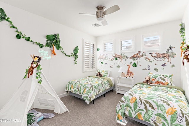 carpeted bedroom with baseboards, visible vents, and a ceiling fan