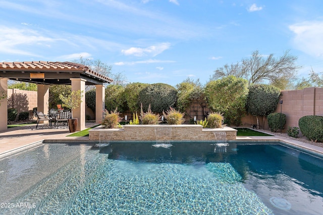 view of swimming pool featuring a fenced in pool, a patio area, and a fenced backyard