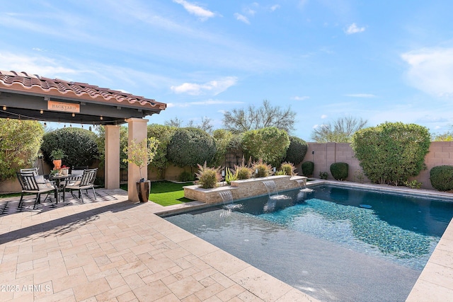 view of swimming pool with a fenced in pool, a patio area, and a fenced backyard