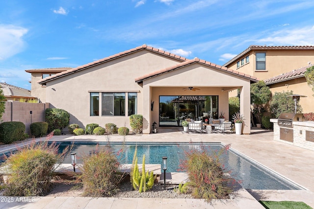 back of property featuring ceiling fan, a patio, area for grilling, fence, and stucco siding