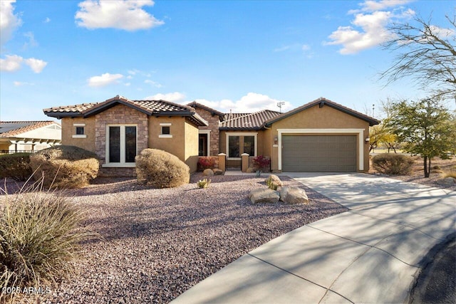 view of front of property with french doors and a garage