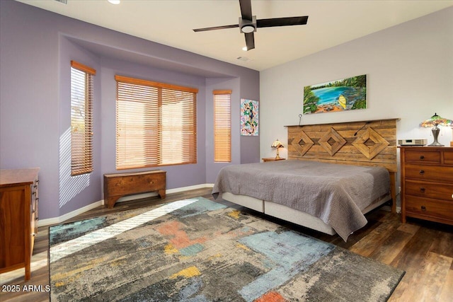 bedroom featuring ceiling fan and dark hardwood / wood-style flooring