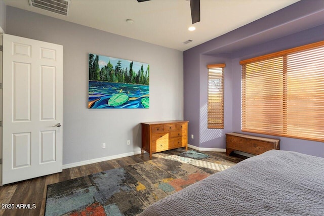 bedroom with dark wood-type flooring and ceiling fan