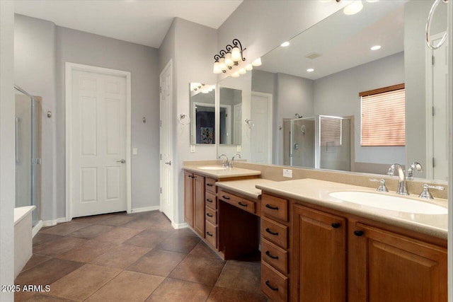 bathroom featuring an enclosed shower, vanity, and tile patterned flooring