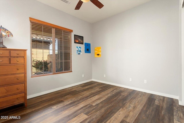 interior space with dark hardwood / wood-style floors and ceiling fan