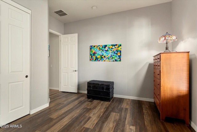 bedroom featuring dark hardwood / wood-style flooring