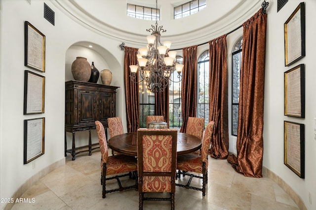 dining space featuring a notable chandelier