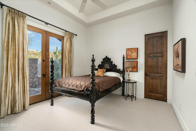 bedroom with ceiling fan, access to exterior, light carpet, and french doors