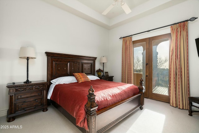 carpeted bedroom with ceiling fan, access to exterior, french doors, and multiple windows