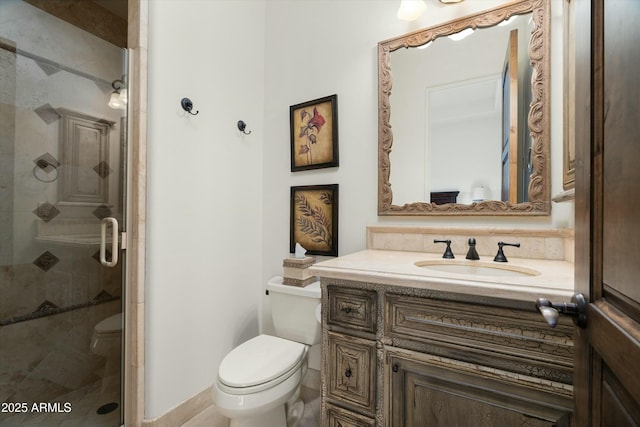 bathroom featuring toilet, a shower with door, and vanity