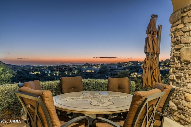 view of patio terrace at dusk