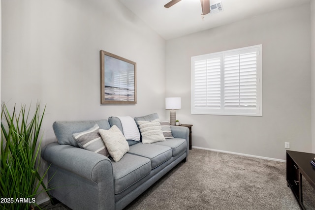 carpeted living room featuring ceiling fan and vaulted ceiling