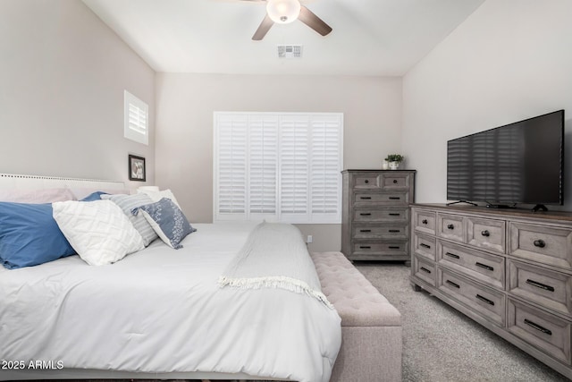 bedroom with ceiling fan and light colored carpet