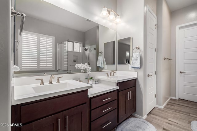 bathroom with vanity, hardwood / wood-style floors, and walk in shower