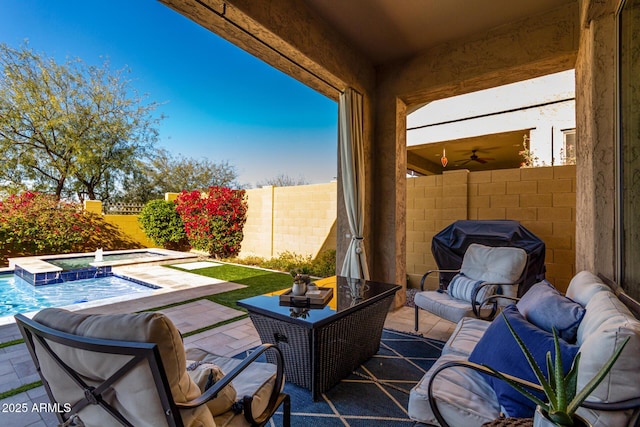 view of patio featuring a swimming pool with hot tub