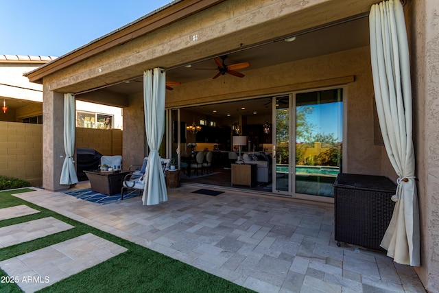 view of patio / terrace featuring ceiling fan